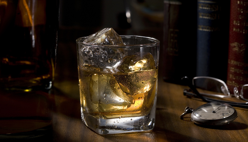 A glass tumbler full of single malt whisky 